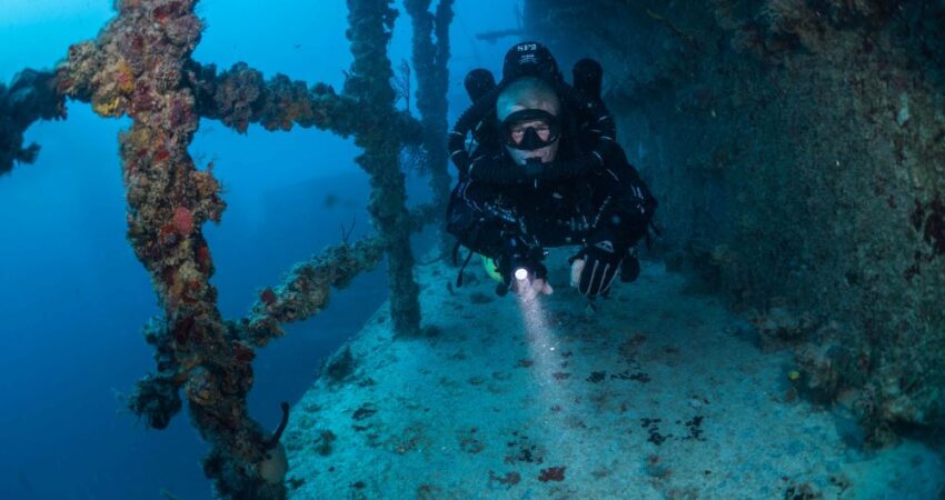Diver exploring outside of a wreck