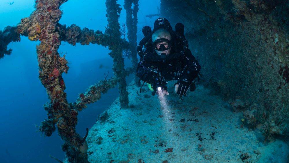 Diver exploring outside of a wreck